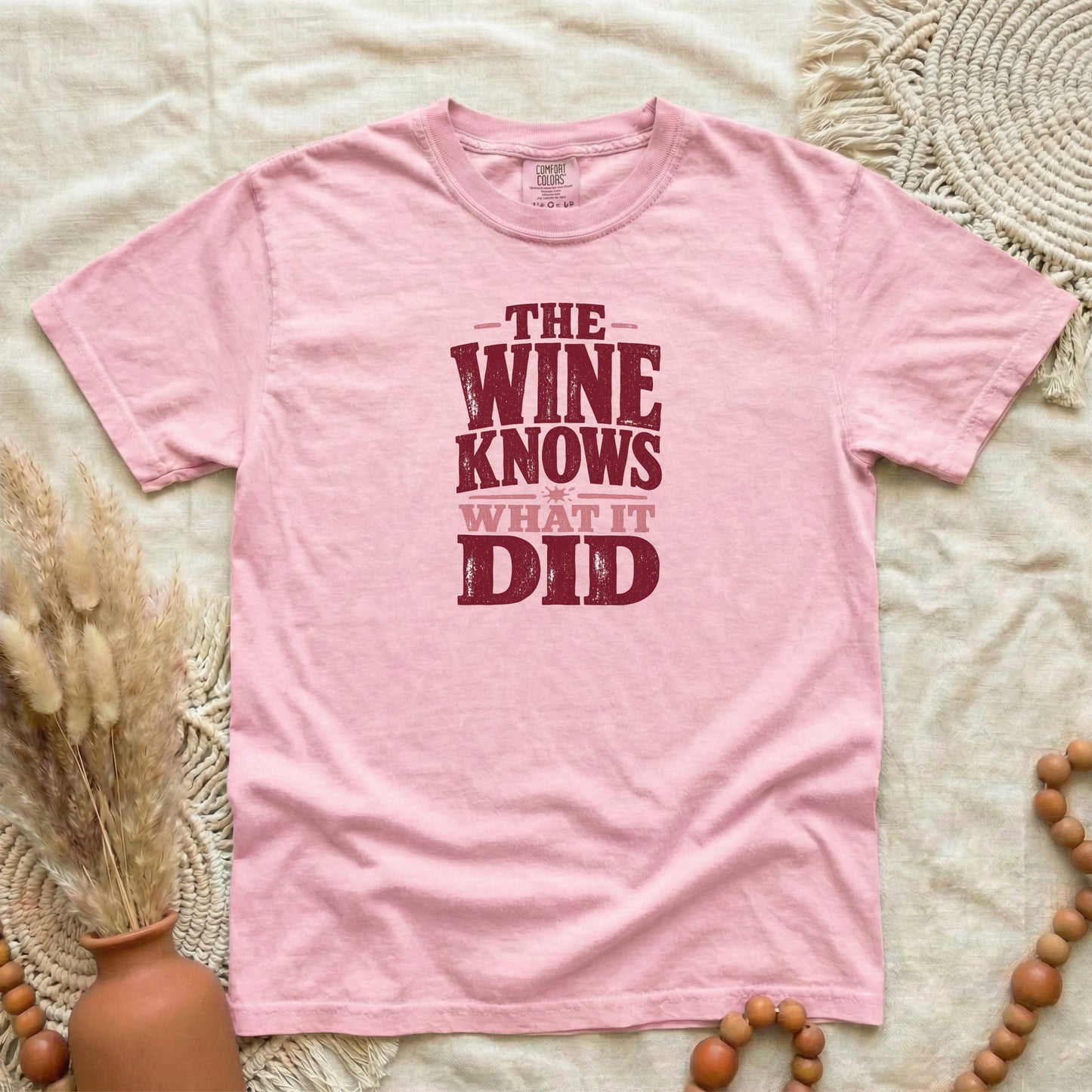Blossom garment-dyed cotton tee printed with "The Wine Knows What It Did".