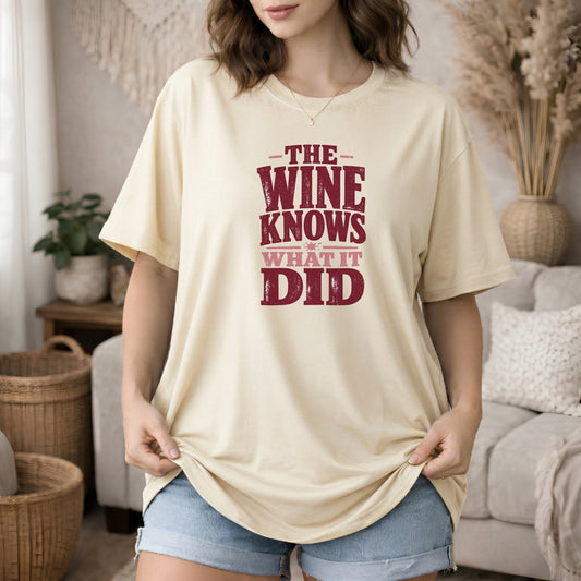 Ivory garment-dyed cotton tee printed with "The Wine Knows What It Did".